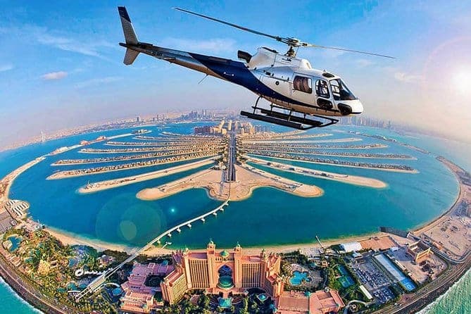 A helicopter flying over Palm Jumeirah and Atlantis The Palm